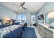 Bedroom with two beds, water views and ceiling fan at 15 Avalon St # 704, Clearwater Beach, FL 33767
