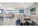 Elegant dining room with stylish chandelier, table setting, and beautiful artwork at 15 Avalon St # 704, Clearwater Beach, FL 33767