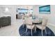 Elegant dining room with stylish table setting and easy access to kitchen and living areas at 15 Avalon St # 704, Clearwater Beach, FL 33767