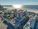 Aerial view of a modern condominium building near the beach with partial ocean views at 15 Avalon St # 704, Clearwater Beach, FL 33767
