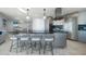 The modern kitchen features stainless steel appliances, a large island, and chic lighting at 15 Avalon St # 704, Clearwater Beach, FL 33767