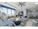Bright living room features floor-to-ceiling windows and plush, comfortable seating with stunning ocean views at 15 Avalon St # 704, Clearwater Beach, FL 33767