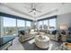 Bright living room features floor-to-ceiling windows and plush, comfortable seating with great city views at 15 Avalon St # 704, Clearwater Beach, FL 33767