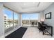 Bright room with large windows, balcony, and a small desk at 15 Avalon St # 704, Clearwater Beach, FL 33767