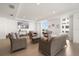 Bright, communal lounge area furnished with stylish sofas and a TV at 15 Avalon St # 704, Clearwater Beach, FL 33767