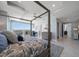 Spacious main bedroom with balcony access and four-poster bed at 15 Avalon St # 704, Clearwater Beach, FL 33767
