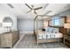 Comfortable main bedroom features a four-poster bed, dresser, and neutral decor at 15 Avalon St # 704, Clearwater Beach, FL 33767