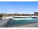 Rooftop pool area with clear glass railings offer city views at 15 Avalon St # 704, Clearwater Beach, FL 33767