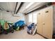 Spacious storage room with lockers and room for beach gear, including chairs and surfboards, and overhead lighting at 15 Avalon St # 704, Clearwater Beach, FL 33767