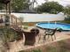 View of the backyard pool and patio area at 1529 Paloma Ln, Dunedin, FL 34698
