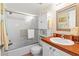 Well-maintained bathroom featuring a shower-tub combo and coordinated decor at 19029 Us Highway 19 # 25D, Clearwater, FL 33764