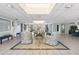 Inviting community lounge area with comfortable seating, holiday decor, and soft lighting at 19029 Us Highway 19 # 25D, Clearwater, FL 33764