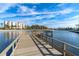 Wooden fishing pier extending into the water with views of the surrounding community at 19029 Us Highway 19 # 25D, Clearwater, FL 33764