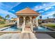Elegant gazebo with water fountains and a tiled walkway at 19029 Us Highway 19 # 25D, Clearwater, FL 33764