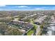 Aerial view of a community of villas with lush landscaping and a central courtyard at 2186 Marshall Dr, Dunedin, FL 34698