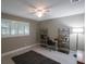 Home office with a desk, shelving unit, and ceiling fan at 2186 Marshall Dr, Dunedin, FL 34698