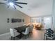 Modern dining room with a dark wood table and neutral decor at 2186 Marshall Dr, Dunedin, FL 34698