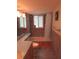 Bathroom with tiled shower and blue countertop and wooden vanity at 24 160Th Ct, Redington Beach, FL 33708