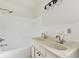 Bathroom featuring double vanity, bathtub, and shower at 3322 W Dorchester St, Tampa, FL 33611