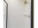 Modern shower with white tile and glass door at 3322 W Dorchester St, Tampa, FL 33611