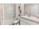 Clean and functional bathroom featuring a tub/shower combo and white vanity at 35313 Mahwah Ave, Dade City, FL 33525