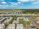 Aerial perspective of townhouses by a highway at 4810 W Mcelroy Ave # 2, Tampa, FL 33611