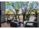 Relaxing balcony with patio furniture and treetop views at 4810 W Mcelroy Ave # 2, Tampa, FL 33611