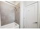 Clean bathroom with grey tile shower and bathtub at 4810 W Mcelroy Ave # 2, Tampa, FL 33611