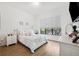 Bedroom with queen-size bed, window, and white dresser at 4810 W Mcelroy Ave # 2, Tampa, FL 33611