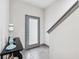 Modern entryway with gray tile floor, gray door, and console table at 4810 W Mcelroy Ave # 2, Tampa, FL 33611