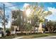 Modern townhome community with sunlit facade and lush landscaping at 4810 W Mcelroy Ave # 2, Tampa, FL 33611