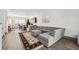 Open concept living area with gray sectional sofa and view into kitchen at 4810 W Mcelroy Ave # 2, Tampa, FL 33611