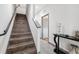 Modern staircase with dark wood steps and metal railing at 4810 W Mcelroy Ave # 2, Tampa, FL 33611