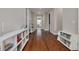 Hallway with hardwood floors and built-in bookshelves at 534 Suwanee Cir, Tampa, FL 33606