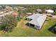 An aerial perspective showcasing a home's roof, yard, and surrounding neighborhood at 5432 Layton Dr, Venice, FL 34293