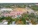 Aerial view of condo building with pool, showcasing surrounding neighborhood at 6058 1St S Ave # 30, St Petersburg, FL 33707