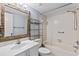 Bathroom features a bathtub, tiled walls, and a marble vanity at 6322 Palma Del Mar S Blvd # 106, St Petersburg, FL 33715