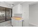 White cabinets and butcher block countertop in kitchen at 6322 Palma Del Mar S Blvd # 106, St Petersburg, FL 33715