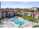 Community pool with surrounding lounge chairs at 6322 Palma Del Mar S Blvd # 106, St Petersburg, FL 33715