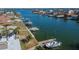 Private dock with boat lift on a canal in a waterfront community at 725 119Th Ave, Treasure Island, FL 33706