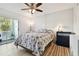 Bedroom with a queen bed and access to a balcony at 7321 Central Ave # 307, St Petersburg, FL 33710