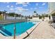 Inviting community swimming pool with surrounding patio furniture at 7321 Central Ave # 307, St Petersburg, FL 33710