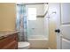 Clean bathroom with tiled shower, granite countertop, and decorative shower curtain at 810 W Whatley Pl, Tampa, FL 33604