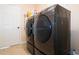 Laundry room featuring front-loading washer and dryer at 810 W Whatley Pl, Tampa, FL 33604