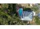House with a pool and a large backyard surrounded by trees at 8620 Brookway Cir, Tampa, FL 33635