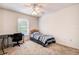 Relaxing bedroom features a twin bed, desk, and natural light from a window at 8620 Brookway Cir, Tampa, FL 33635