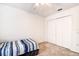 Well-lit bedroom featuring built-in closet and carpet flooring at 8620 Brookway Cir, Tampa, FL 33635