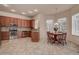 Well-lit eat-in kitchen featuring stainless steel appliances and wood cabinets at 8620 Brookway Cir, Tampa, FL 33635