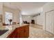 Kitchen with granite island overlooking Gathering room at 8620 Brookway Cir, Tampa, FL 33635