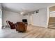 Spacious living room with hardwood floors and brown leather recliners at 8620 Brookway Cir, Tampa, FL 33635